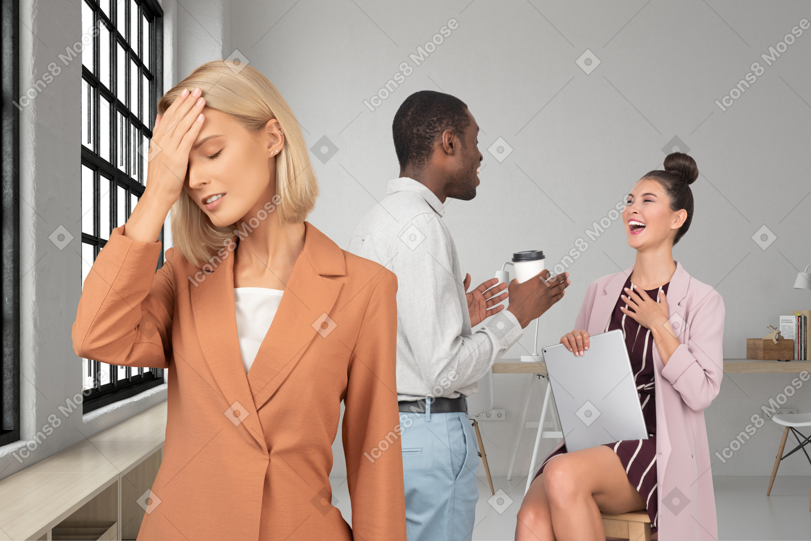 A woman is keeping her hand near her brow and woman on the chair with a laptop is laughing with a black man drinking coffee