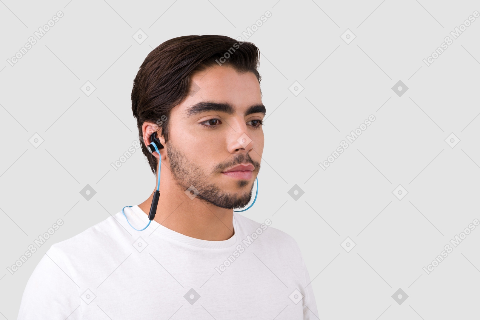 A man wearing a headset and a white t - shirt