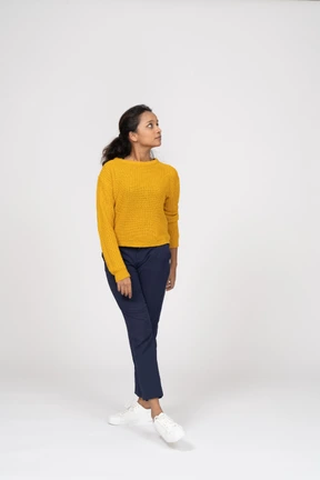 Front view of a girl in casual clothes looking up