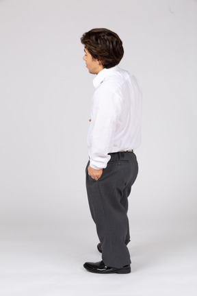 Side view of man with hand in pocket