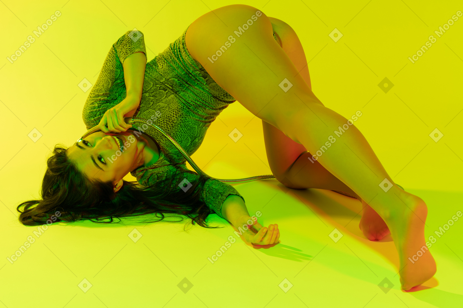 Delighted female talking on the phone in sensual pose