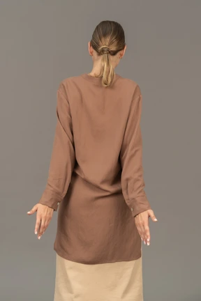 Back view of a woman stretching her back