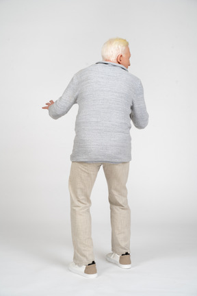 Back view of a man standing and looking away
