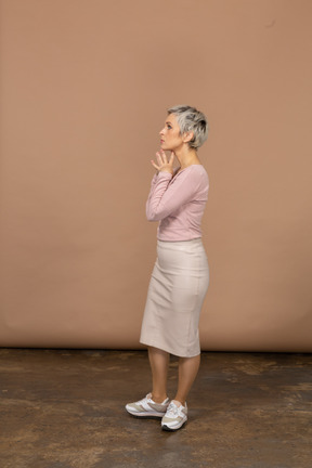 Side view of a thoughtful woman in casual clothes
