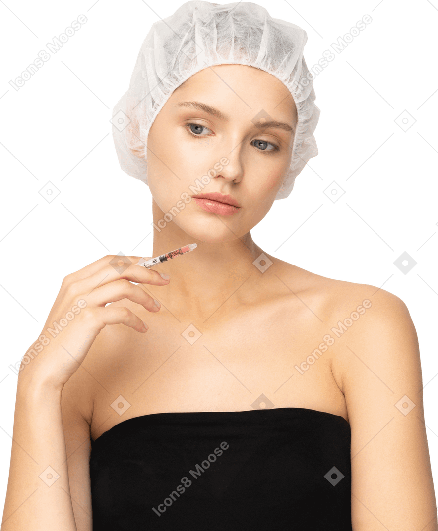 Woman with syringe near her face