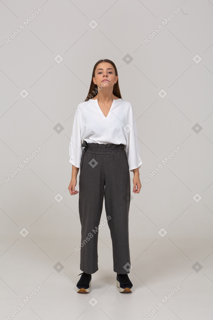 Front view of a young lady in office clothing outstr