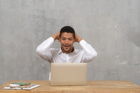 Young man with his hands on nape