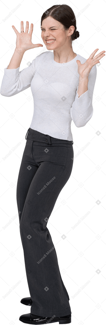 Front view of a delighted young woman in office clothing