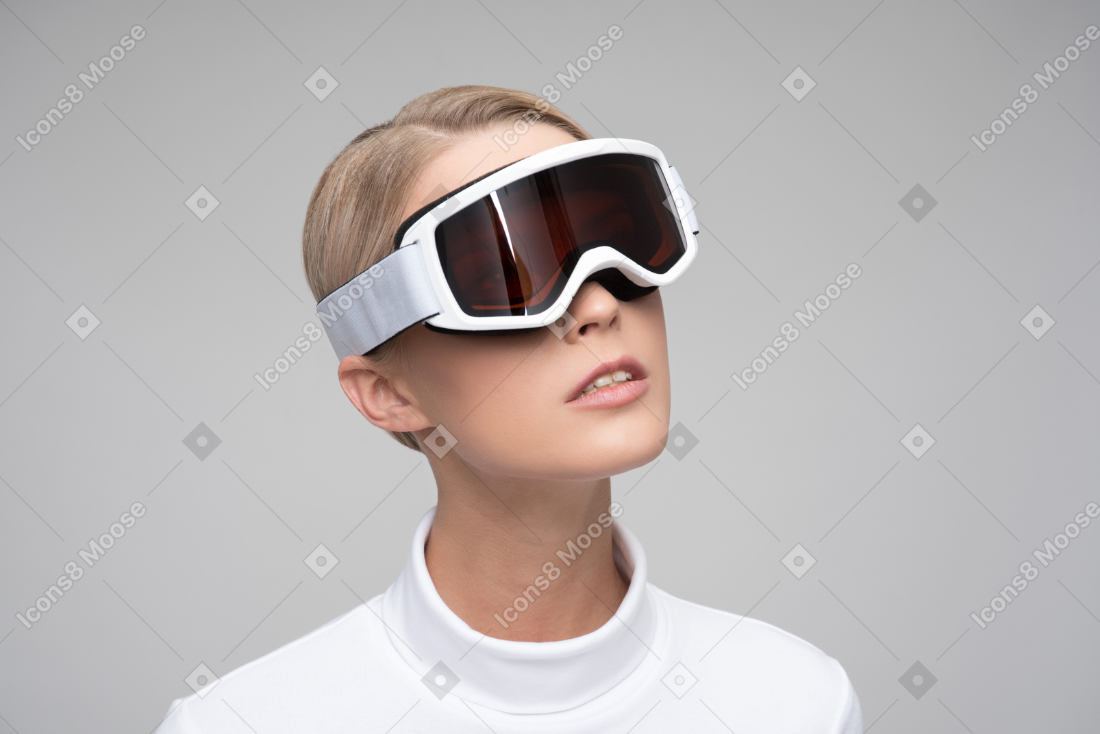 Young blonde woman in ski goggles seeing the reality in different dimension