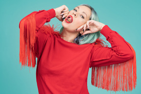 A young woman keeping her tongue out