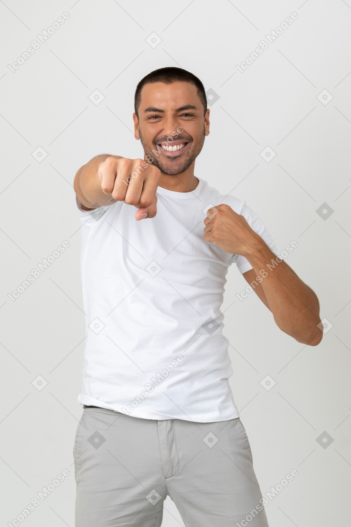 Happy young guy with clenched fist