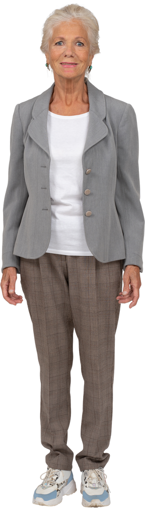 Front view of a beutiful old lady in suit looking at camera
