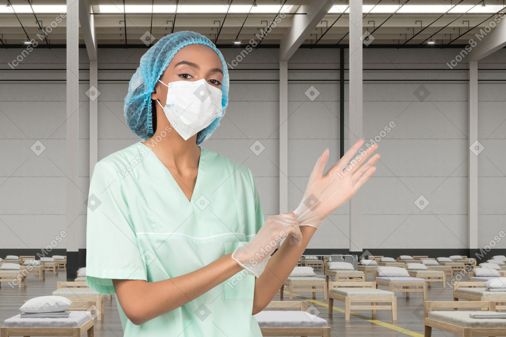 Masked young doctor putting on medical gloves