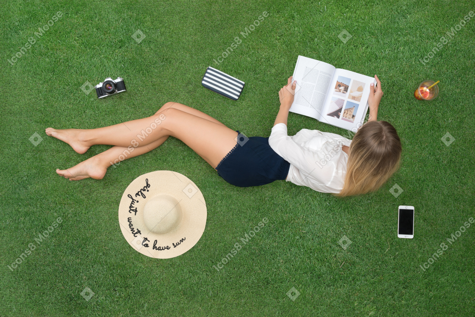 Woman flipping through news and enjoying the sun