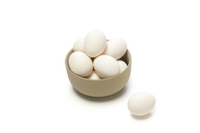 Chicken eggs in a ceramic bowl