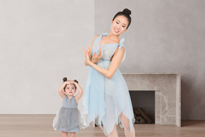 Adult ballerina and child ballerina