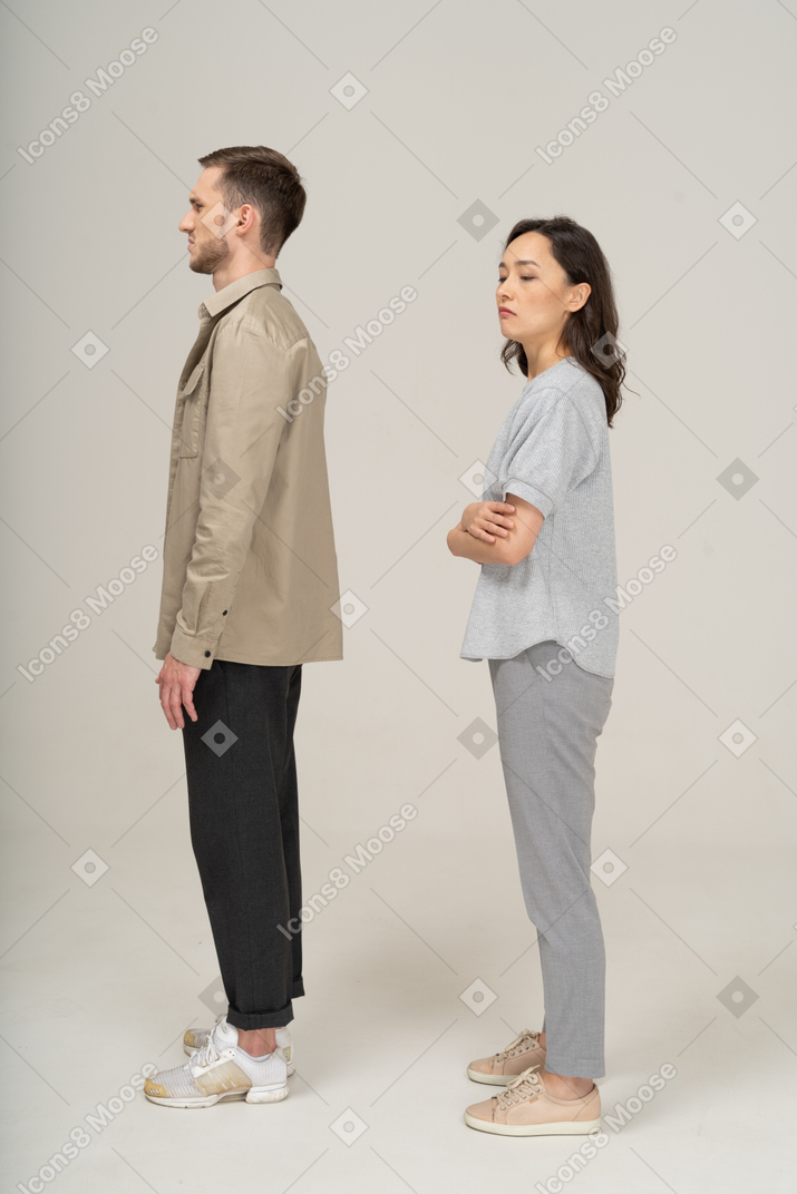 Side view of young couple being squeamish