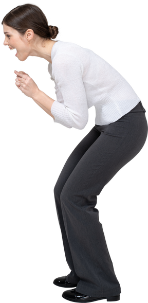 Side view of a happy woman bending down