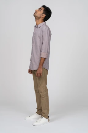 Young man in casual clothes standing