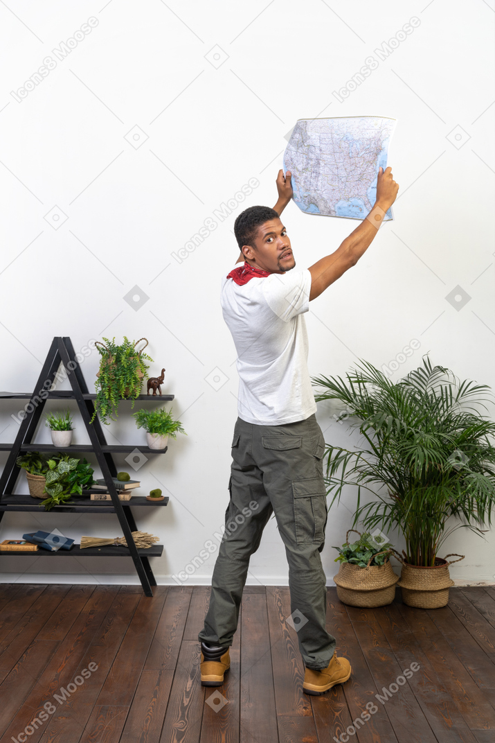 Good looking young man with a map