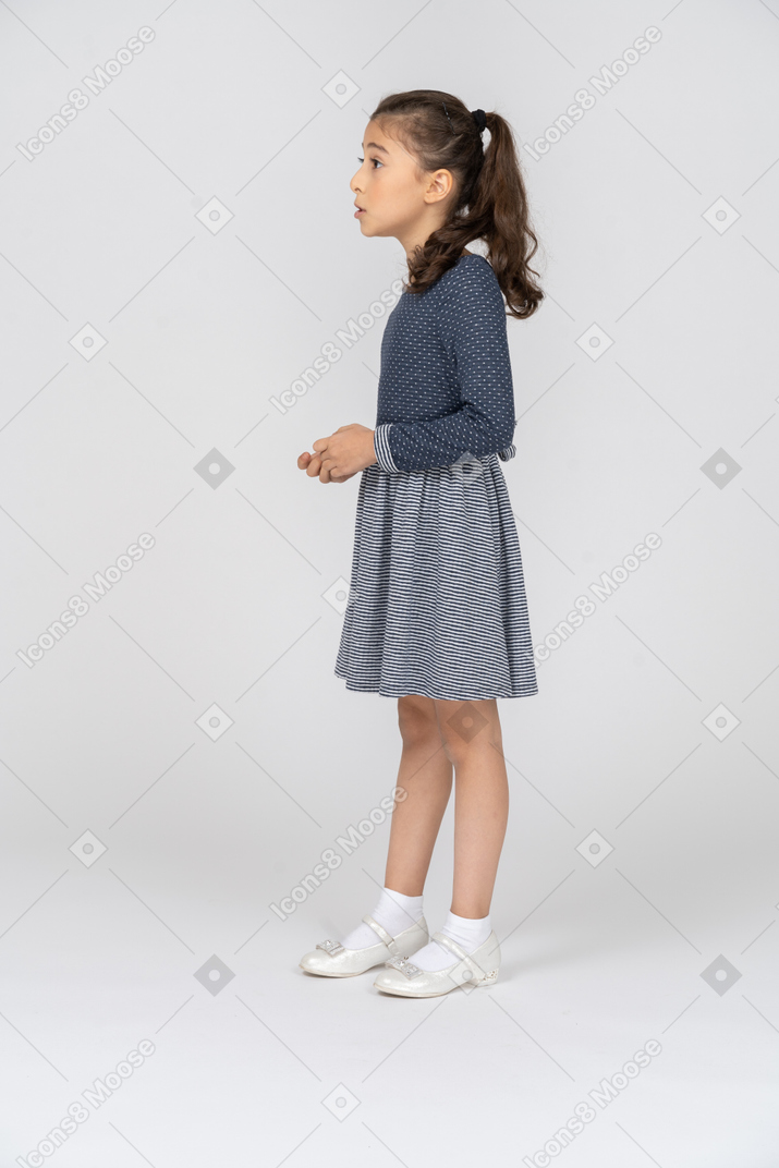 Side view of a girl talking eagerly