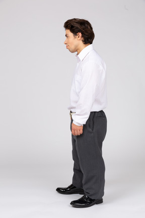 Side view of a standing young man