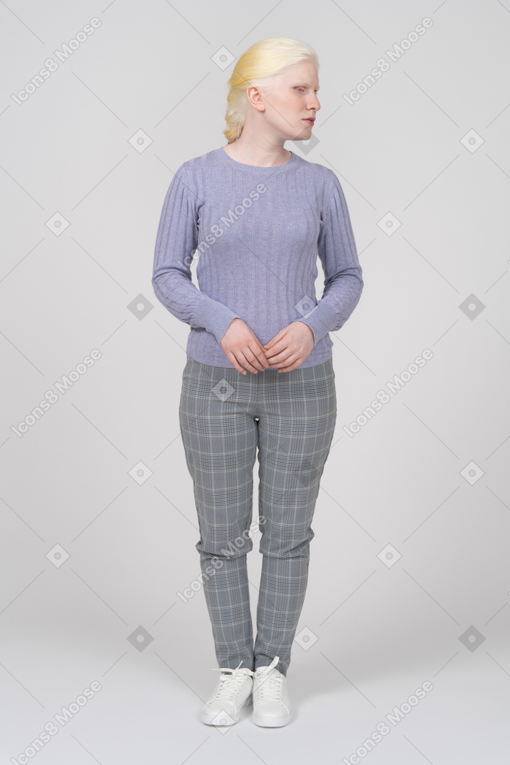 Young woman in casual clothes looking to the right