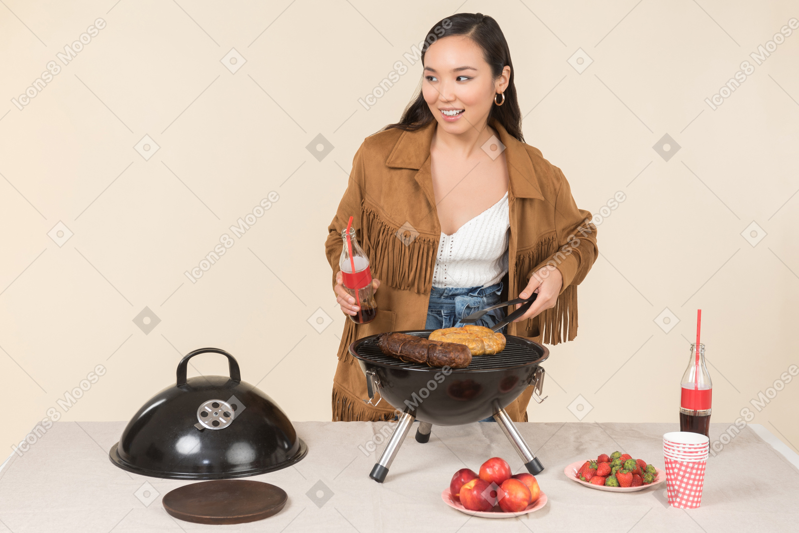 Young asian woman holding bottle of coke and doing a bbq