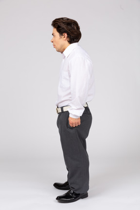 Side view of a young office worker looking away