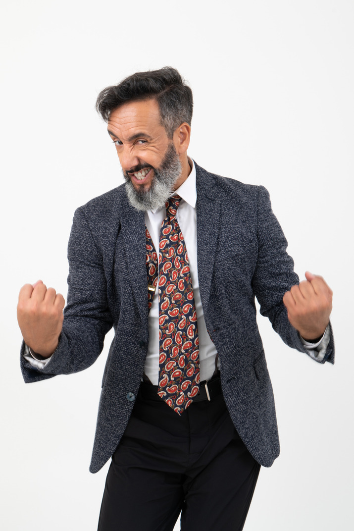 Man in suit showing his fists and angry face, 'ready to do this' position