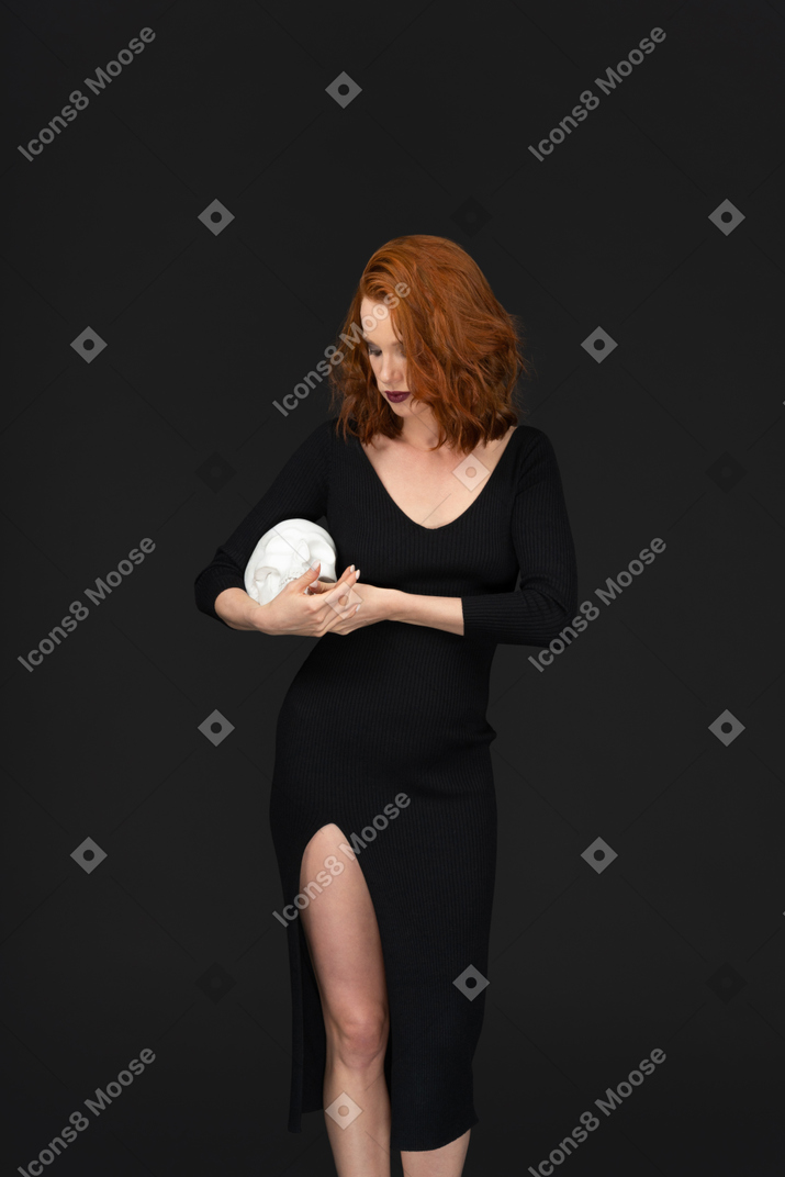 Beautiful woman holding a skull