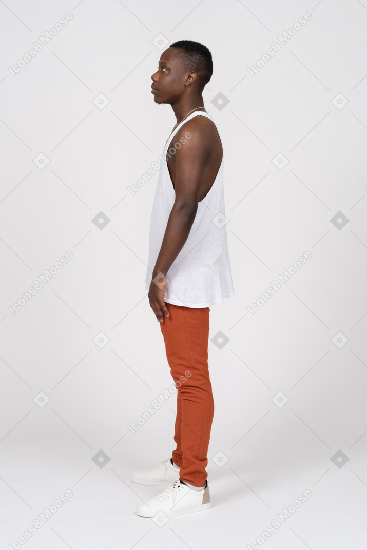 Side view of confident young man on grey background. Royalty-Free Stock  Image - Storyblocks