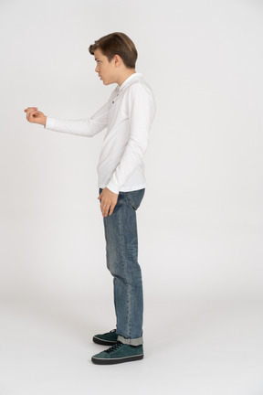 Young man in casual clothes standing