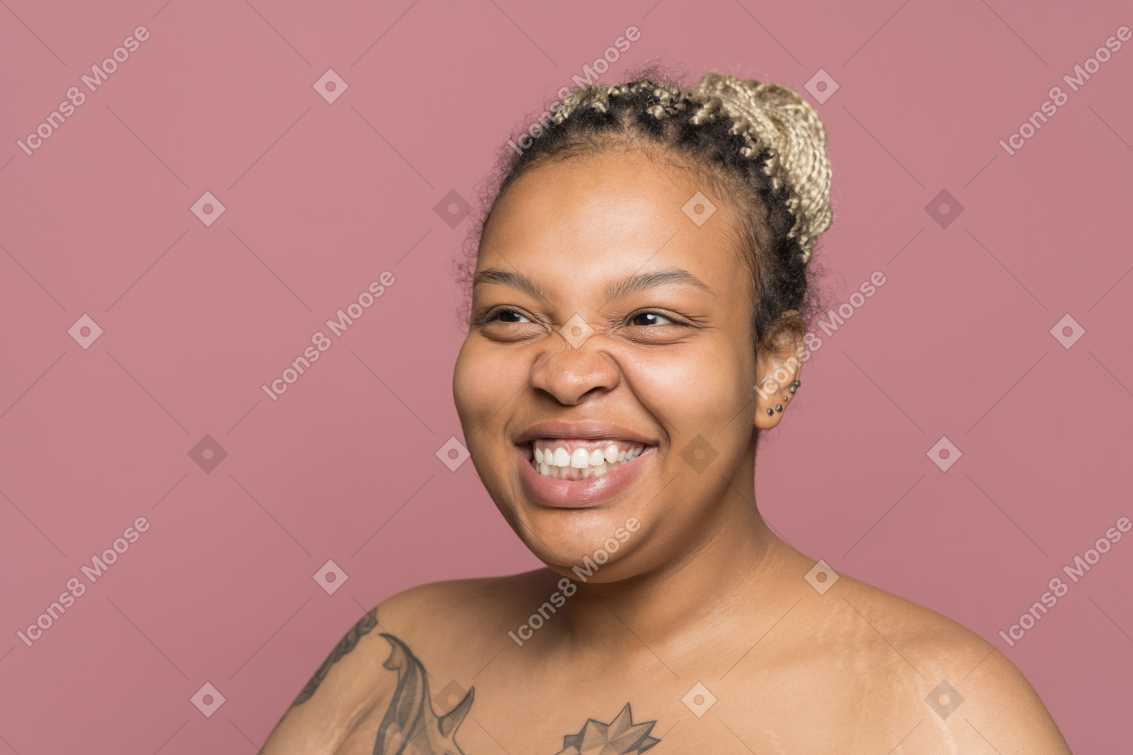 Happy beautiful afro woman smiling and looking aside