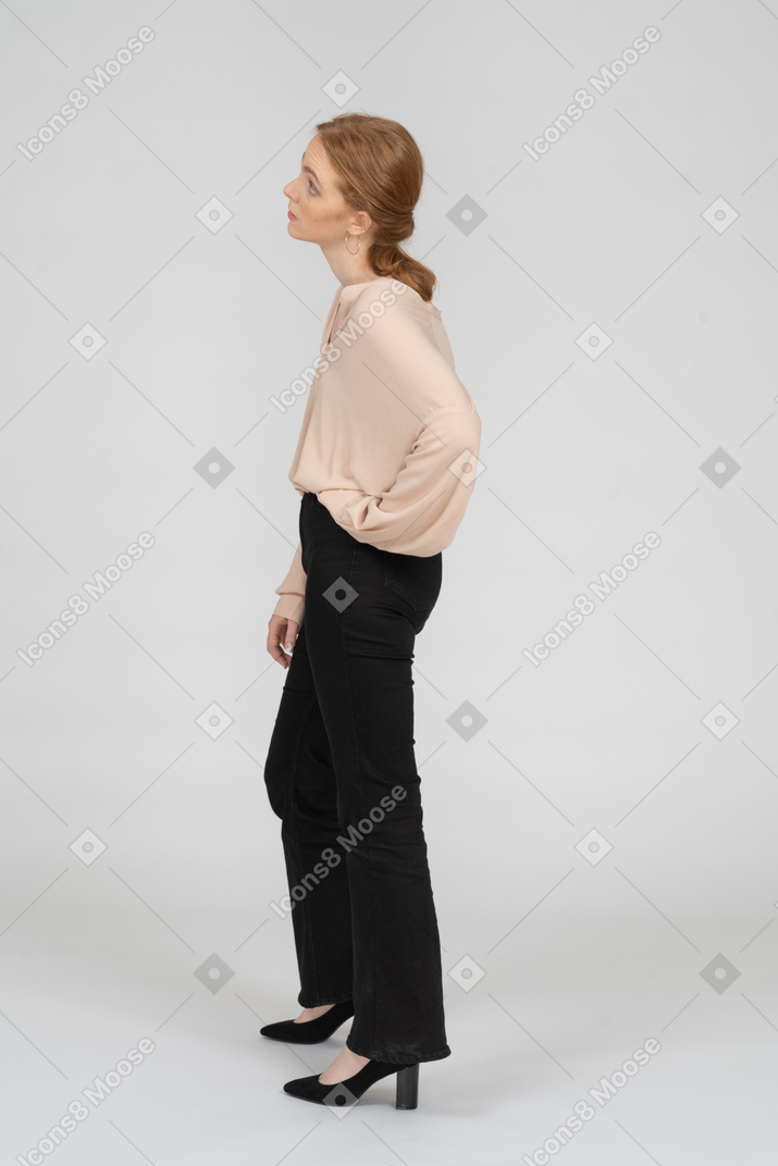 Woman in beautiful blouse standing