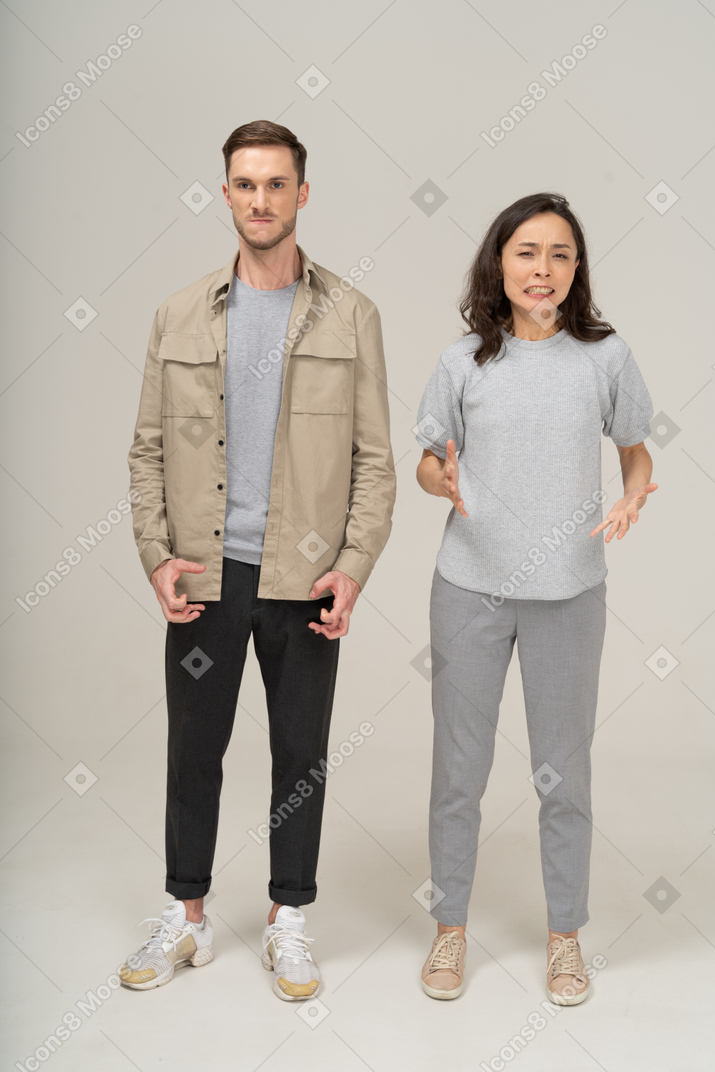 Front view of young couple being annoyed