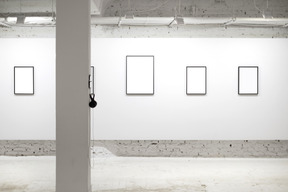 Empty frames on white wall