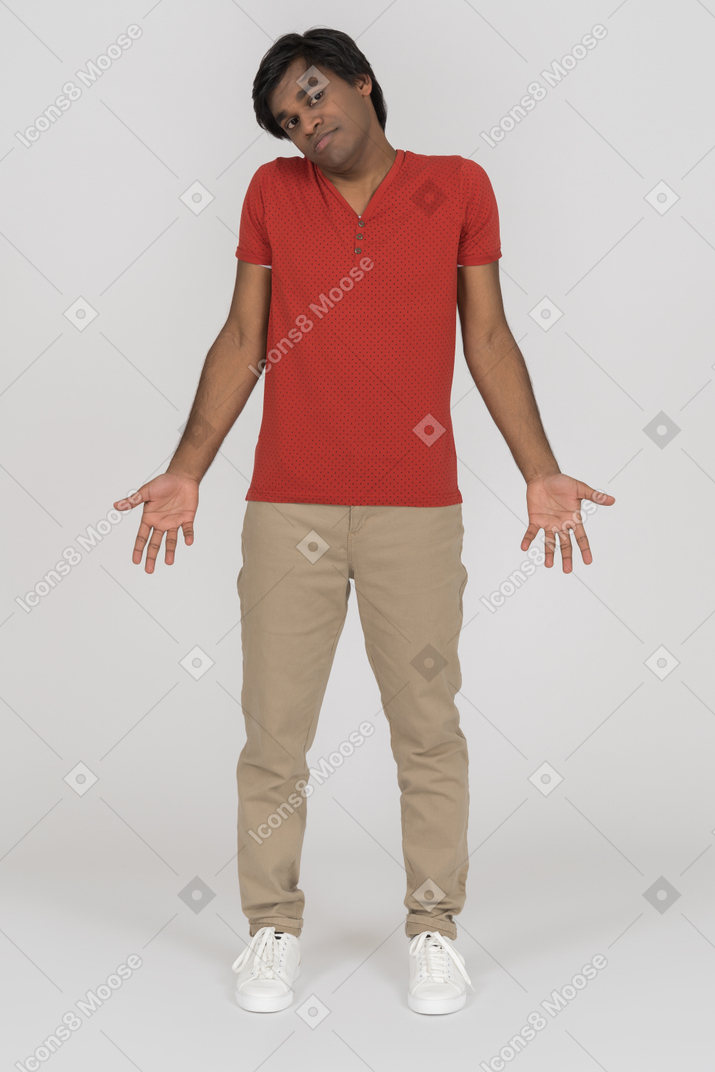 Young man shugging and spreading arms