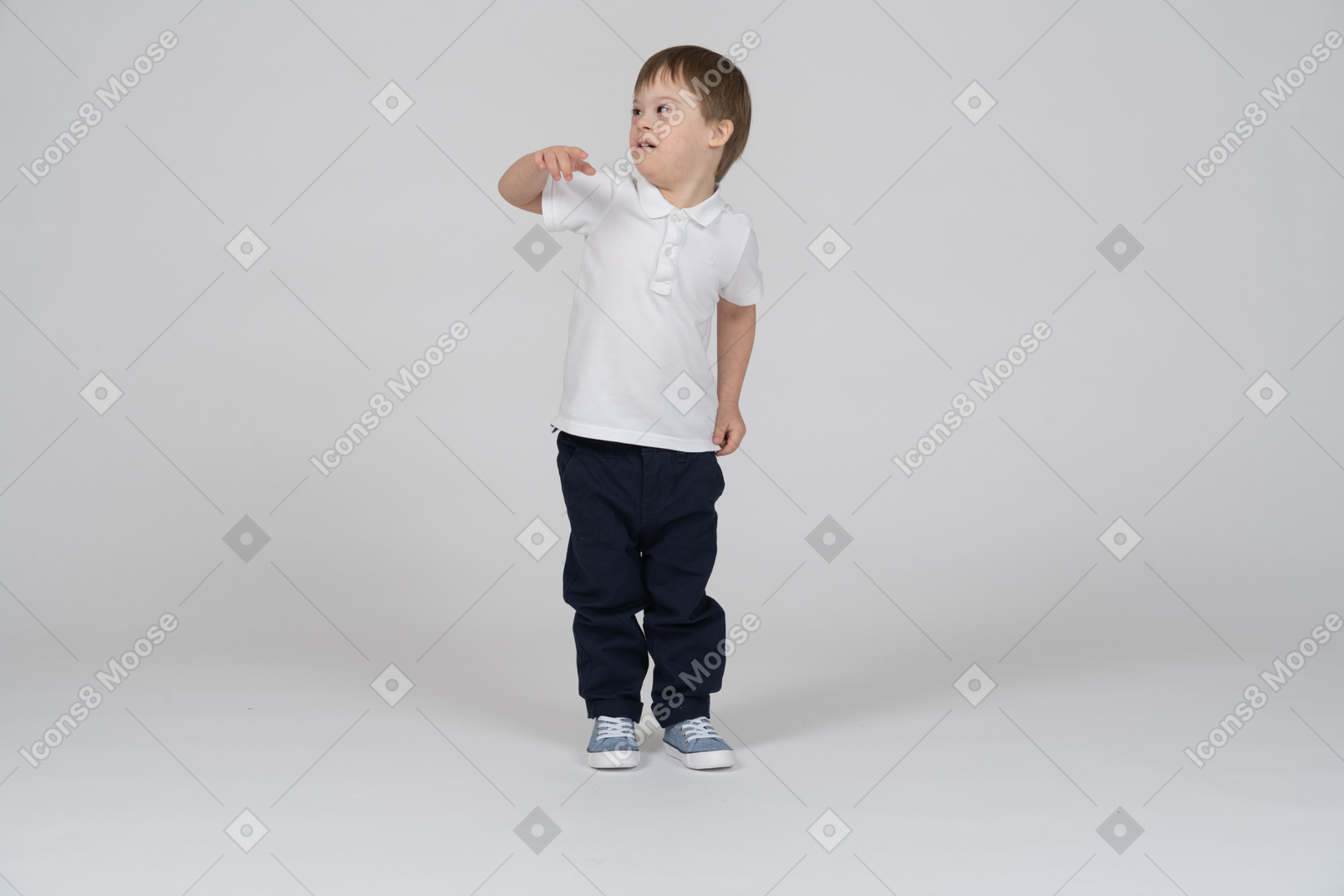 Front view of little boy pointing at camera