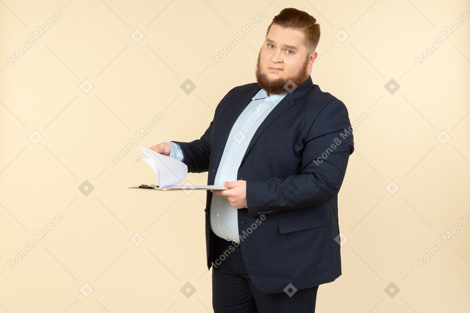 Overweight male office worker revising papers