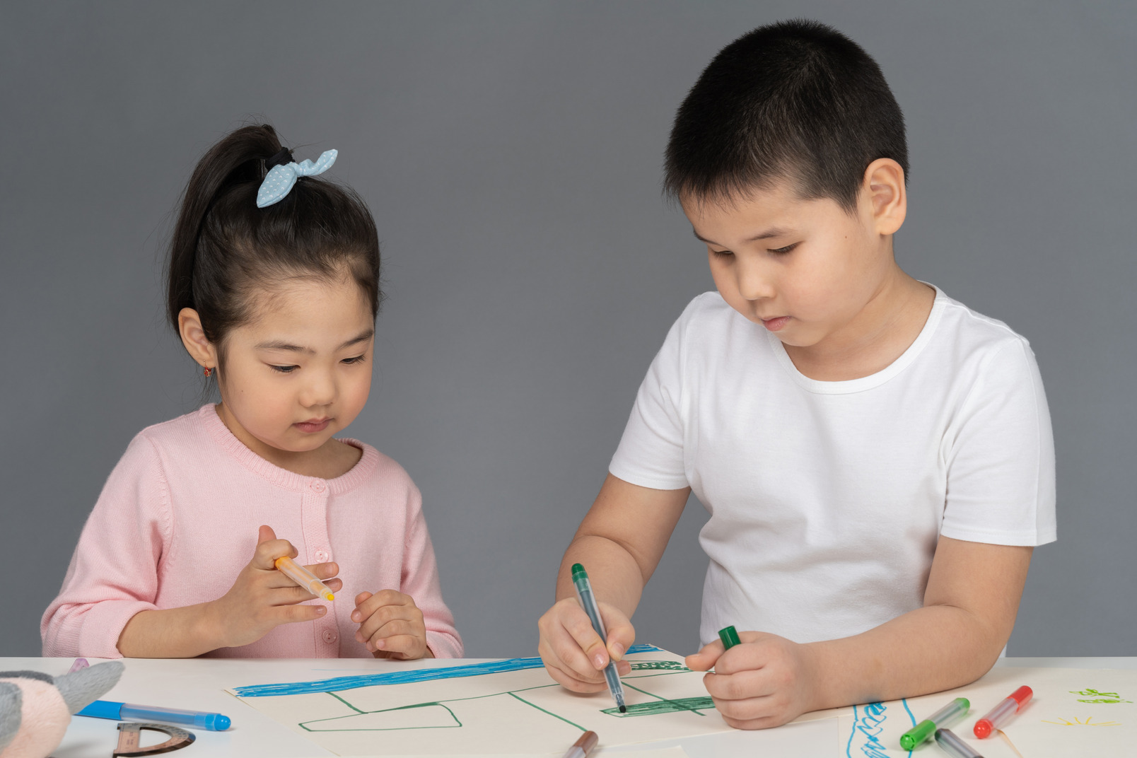 Little boy and girl making a drawing