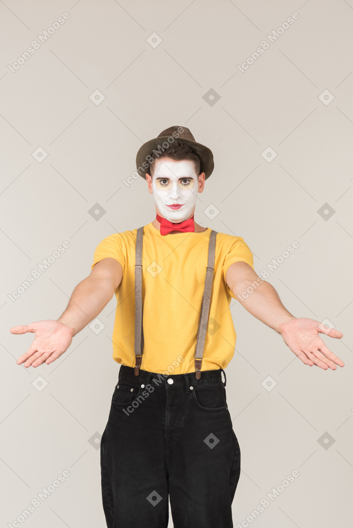 Male clown standing with open arms