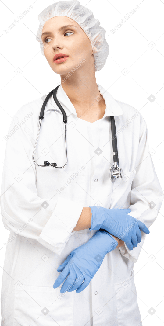 Vue de face d'une jeune femme médecin fatiguée avec stéthoscope main dans la main