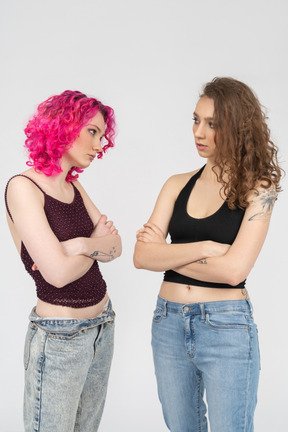 Two young women looking at each other