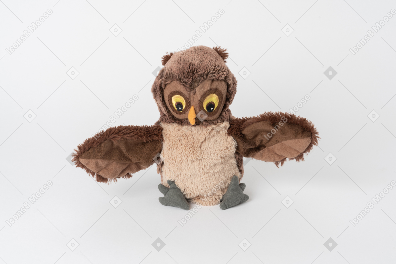 A cute brown plush owl sitting isolated against a plain white background