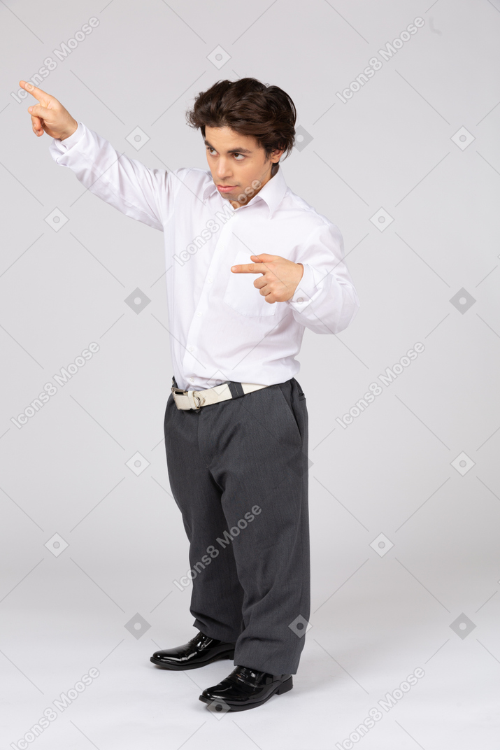 Young man pointing up