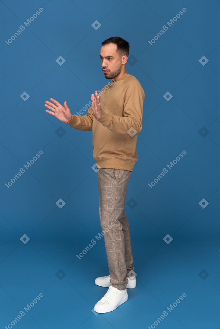 Young man with raised hands