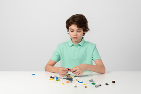 Boy playing with building blocks