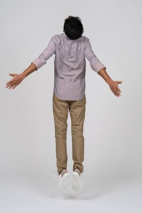 Man in casual clothes jumping