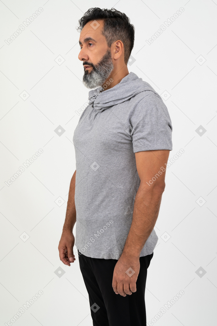 Mature man standing in profile